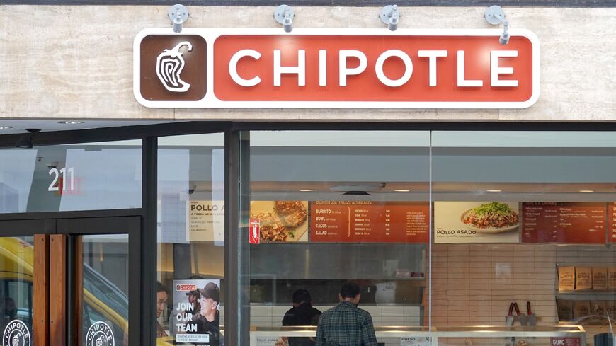 A customer orders food at a Chipotle restaurant on April 26, 2022, in San Francisco, California.