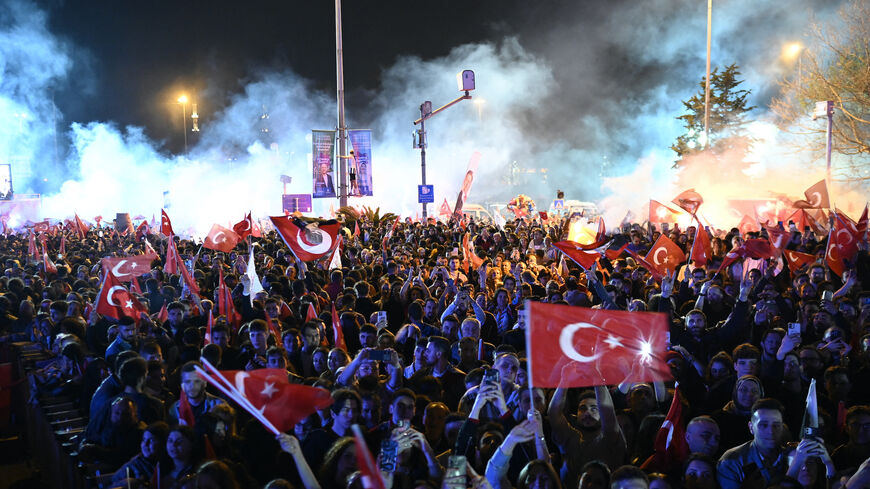 Opposition Republican People's Party (CHP) supporters celebrate outside the main municipality building following municipal elections across Turkey, in Istanbul on March 31, 2024. Turkey's main opposition party on March 31 claimed victory in Istanbul and Ankara, with its rising political star emerging from local elections as a serious challenger to veteran President Recep Tayyip Erdogan. Erdogan, addressing supporters at his party's headquarters in Ankara, acknowledged a "turning point" for his party and pro