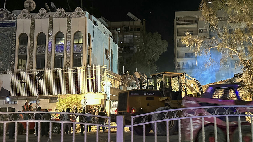 Syrian emergency and security personnel continue to search and remove the rubble at the site of strikes that hit a building annexed to the Iranian Embassy on April 1, Damascus, Syria, April 2, 2024.