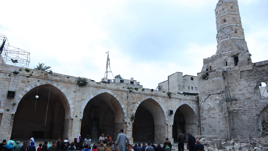 Palestinian worshippers gather on April 10, 2024 in the courtyard of Gaza City's historic Omari Mosque, which has been heavily damaged in Israeli bombardment during the ongoing battles between Israel and Hamas, on the first day of Eid al-Fitr to mark the end of the Islamic fasting month of Ramadan. (Photo by AFP) (Photo by -/AFP via Getty Images)