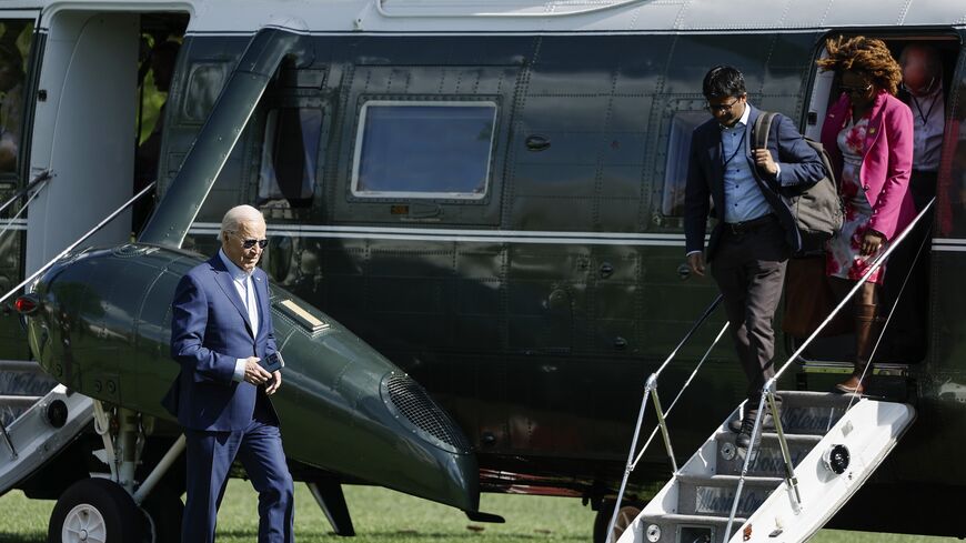 US President Joe Biden walks on the South Lawn after landing on Marine One with senior members of his staff at the White House on April 18, 2024, in Washington, DC. 