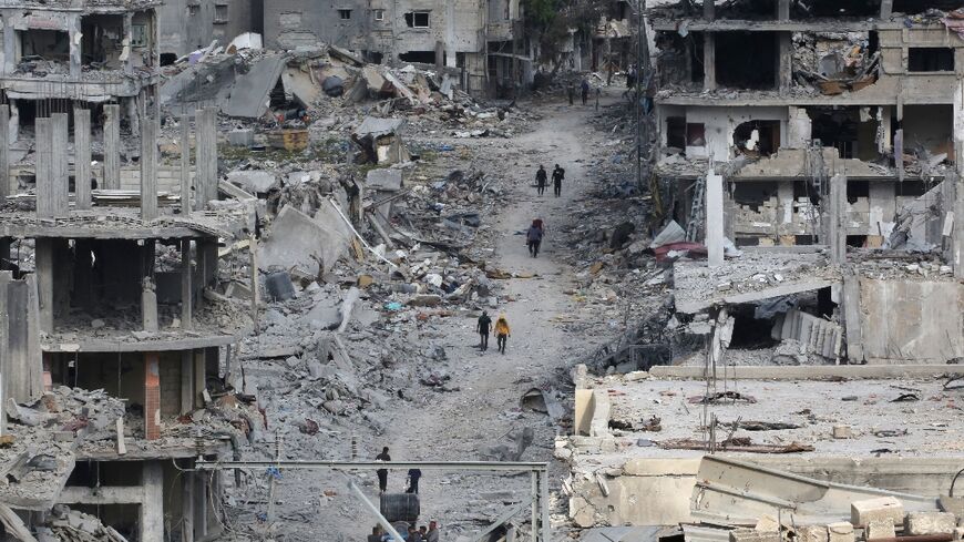 Gazans returning to the city of Khan Yunis confronted mounds of rubble where houses and shops once stood