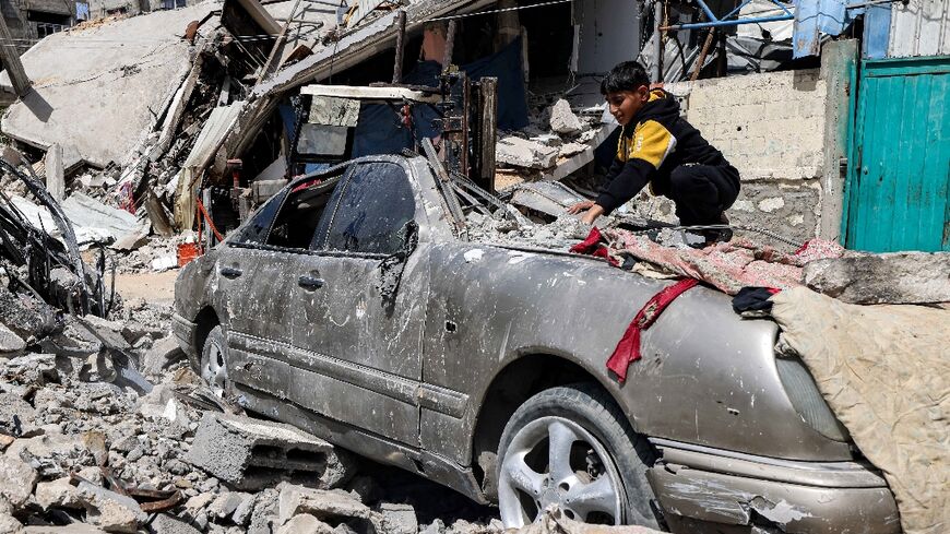 Six months of bloodshed have left much of the Gaza Strip in ruins -- a boy clears rubble in Rafah, where around 1.5 million people are sheltering