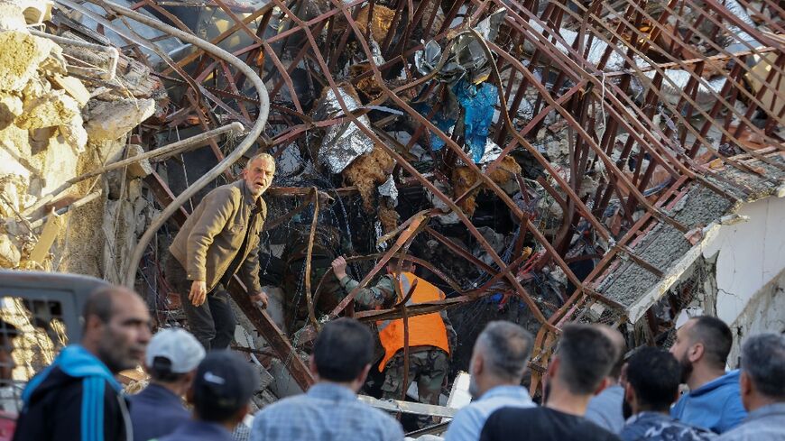 Emergency services were searching for victims under the rubble as sirens wailed in the upscale Damascus district of Mazzeh