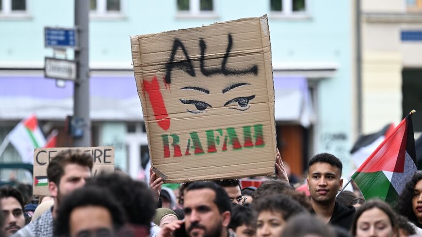 A participant holds up a placard during a pro-Palestinian protest in Berlin on May 18