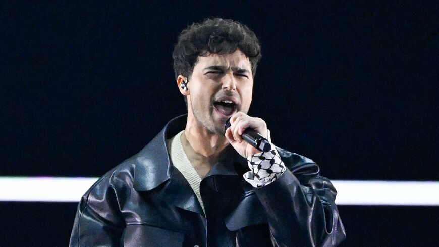 Eric Saade performs at the Eurovision song contest with a pro-Palestinian Kefiyeh scarf on his arm. Organisers expressed regret