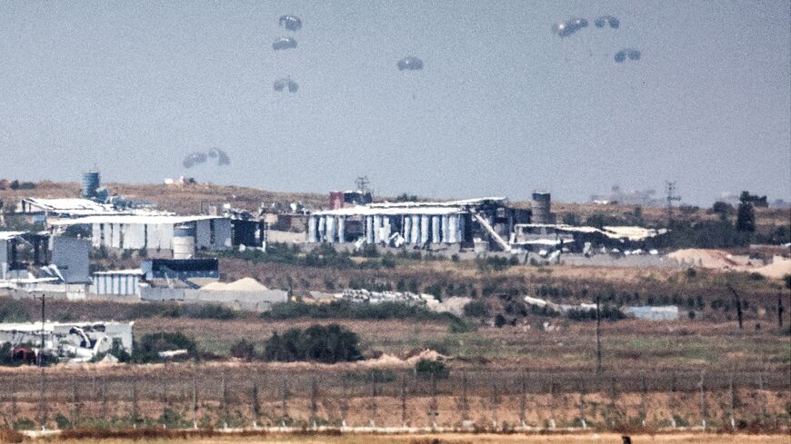 Humanitarian aid is airdropped over the Gaza Strip on May 9 as relief agencies warn of a looming famine in the war-devastated territory