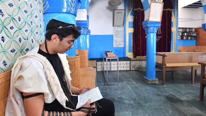 A Tunisian man prays at a synagogue in Djerba during an annual Jewish pilgrimage