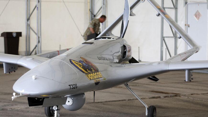 A Turkish Bayraktar TB2 combat drone is on view during a presentation at the Lithuanian Air Force Base in Siauliai, Lithuania, on July 6, 2022.
