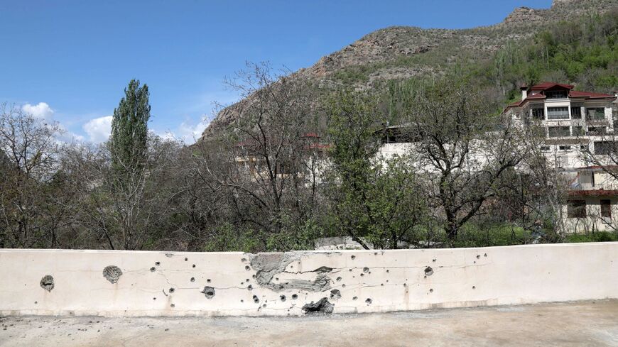 This picture taken on April 25, 2023, shows a shrapnel-pocked walled in the village of Hiror near the Turkish border in northern Iraq's autonomous Kurdish region, where firefights occur between the Turkish army and fighters from the Kurdistan Workers' Party (PKK).