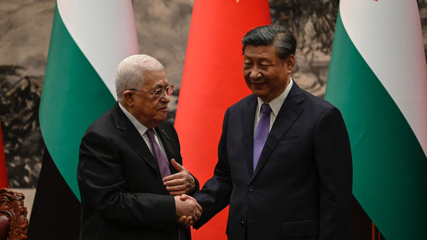 Palestinian President Mahmud Abbas shakes hands with China's President Xi Jinping after a signing ceremony at the Great Hall of the People in Beijing on June 14, 2023. (Photo by Jade GAO / POOL / AFP) (Photo by JADE GAO/POOL/AFP via Getty Images)