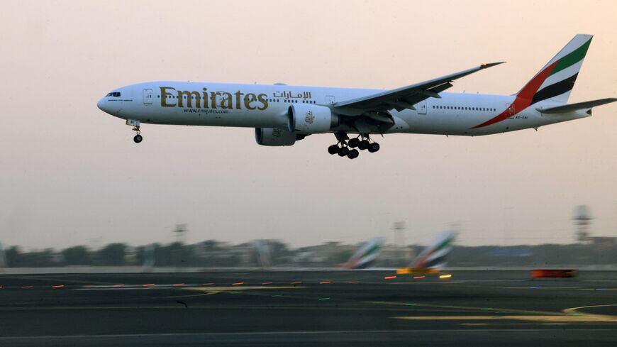 An Emirates Airlines plane lands at Dubai International Airport in Dubai on October 17, 2023. (Photo by Karim SAHIB / AFP) (Photo by KARIM SAHIB/AFP via Getty Images)