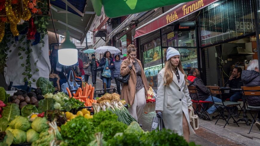 People walk at Kadikoy district in Istanbul on March 5, 2024. Turkey's annual inflation rose again in February, reaching 67.1 percent despite a string of interest rate hikes, official data showed on Monday. The Turkish central bank held its key interest rate at 45 percent last month, pausing after eight straight increases aimed at taming consumer prices that had remained stable at 64.9 percent in January.