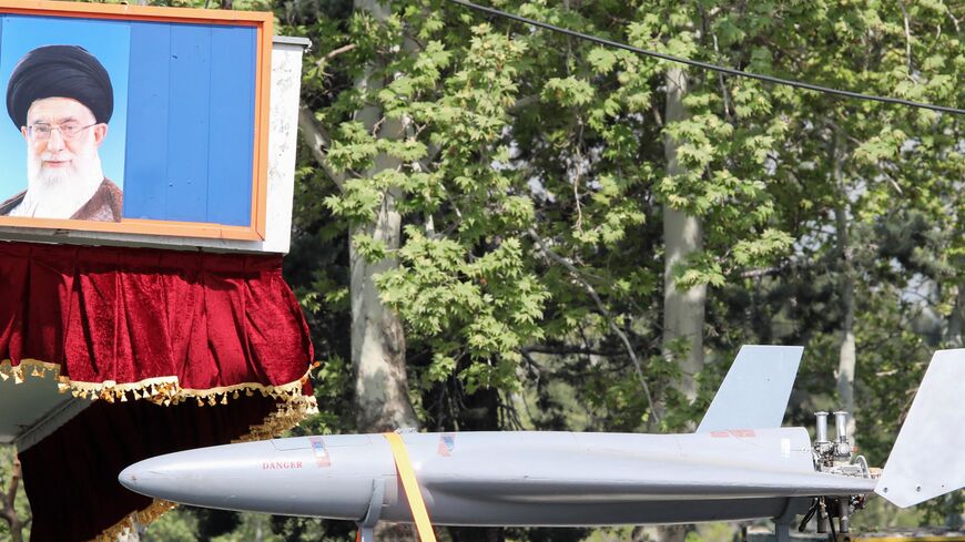 A military truck carries an Arash drone past a portrait of Iranian supreme leader Ayatollah Ali Khamenei during a military parade as part of a ceremony marking the country's annual army day in Tehran, on April 17, 2024.