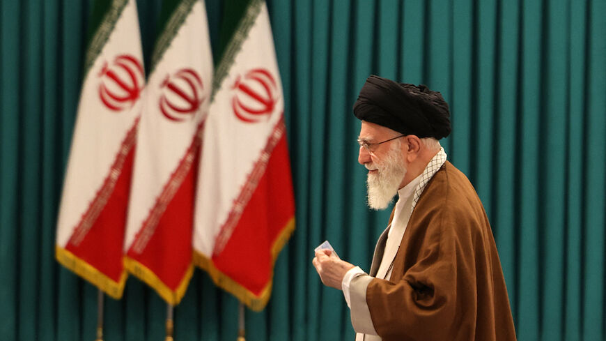 Iran's Supreme Leader Ayatollah Ali Khamenei arrives to cast his ballot during the parliamentary runoff elections in Tehran on May 10, 2024. (Photo by ATTA KENARE / AFP) (Photo by ATTA KENARE/AFP via Getty Images)