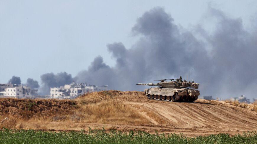 An Israeli army battle tank takes a position in southern Israel near the border with the Gaza Strip on May 13, 2024, amid the ongoing conflict in the Palestinian territory between Israel and the Hamas movement.