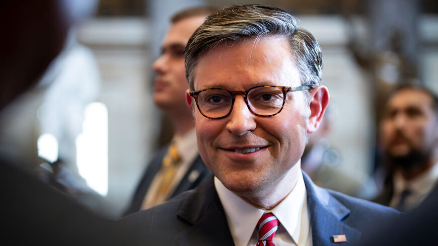 House Speaker Mike Johnson (R-LA) greets people attending the unveiling of a statue of evangelist Rev. William Franklin "Billy" Graham, Sr. at the Capitol in Statuary Hall, Washington, DC, May 16, 2024. 