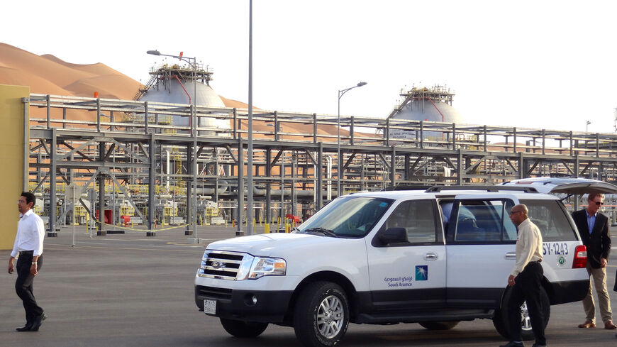 A Saudi Aramco car with visiting journalists is seen outside the company's Natural Gas Liquids plant in Saudi Arabia's remote Empty Quarter near the United Arab Emirates, on May 10, 2016. Despite collapsed global oil prices, production is expanding at Shaybah, as it is in other units of the company at the centre of the kingdom's Vision 2030 drive for diversification away from oil. The Saudi government plans to sell less than five percent of the company in what officials say will be the world's largest-ever 