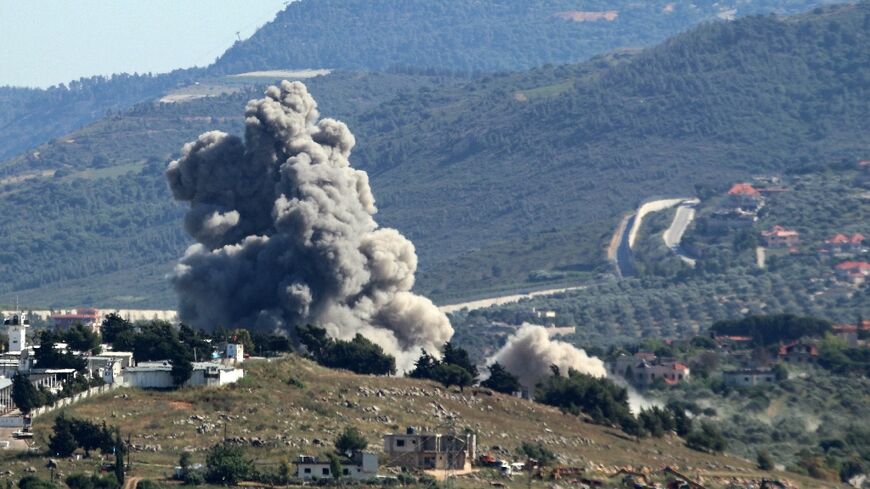 Smoke rises over the south Lebanese village of Kfar Kila during Israeli bombardment