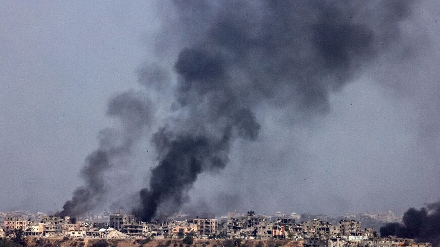 Smoke plumes from explosions billow in the Gaza Strip on May 21, 2024