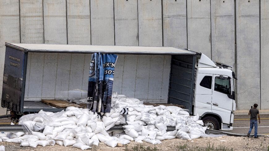 A truck with scattered aid supplies for Gaza after it was vandalised by right-wing Israeli activists near the West Bank village of Shekef on May 13, 2024