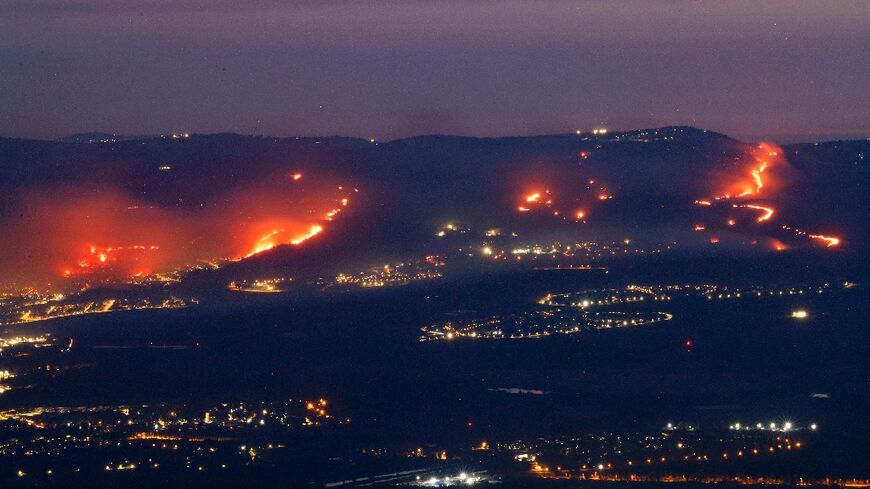 Fires burn in northern Israel as a result of rockets launched from Lebanon amid cross-border clashes between Israeli troops and Hezbollah