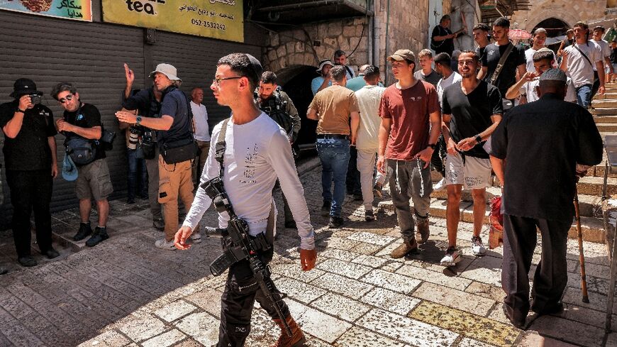 Israeli right-wing activists attend a march commemorating Jerusalem Day