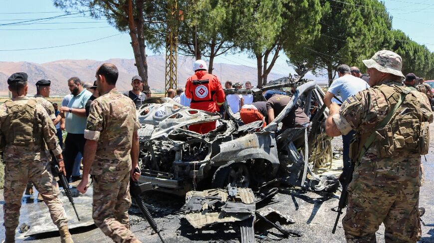 Security forces and emergency workers at the scene of the air strike