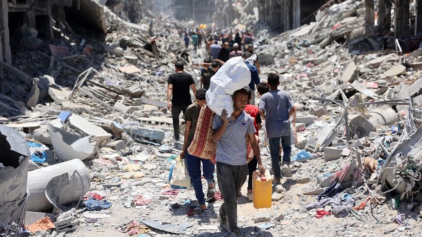 Scores of Palestinians streaming into north Gaza's Jabalia area, trying to find their homes and salvage whatever belongings are left