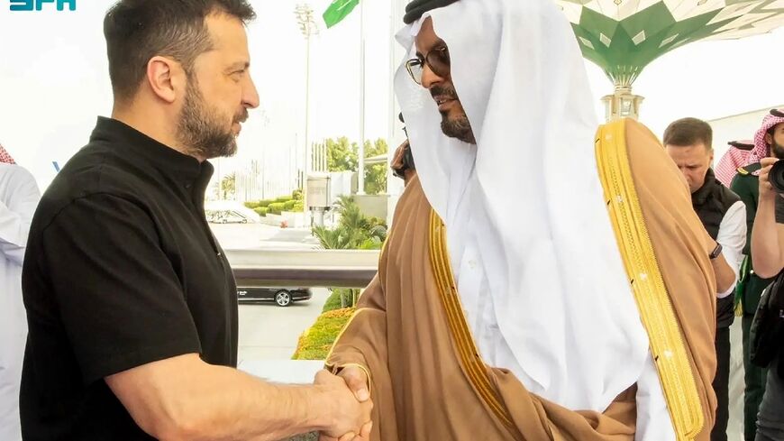 Ukraine's President Volodymyr Zelensky is welcomed by Mecca deputy governor Saud bin Mishaal bin Abdulaziz Al-Saud at Jeddah airport