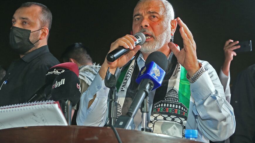 Hamas' political bureau chief Ismail Haniyeh addresses supporters during a rally in solidarity with the Palestinians outside Qatar's Imam Muhammad Abdel-Wahhab Mosque in the capital Doha on May 15, 2021. - Qatar's Foreign Minister hosted the political chief of Palestinian Islamist movement Hamas and called for an end to Israel's bombardment of Gaza, state media said. (Photo by KARIM JAAFAR / AFP) (Photo by KARIM JAAFAR/AFP via Getty Images)