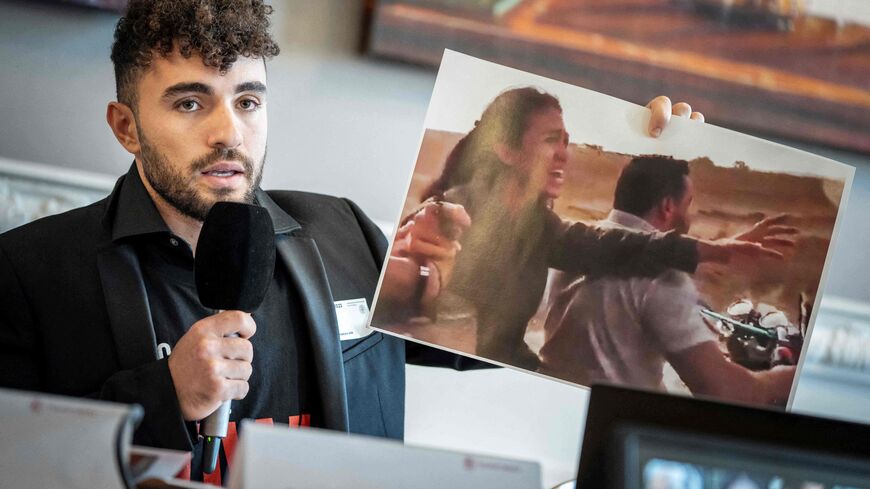 Ofir Tamir shows a placard of Noa Argamani during a press conference with other relatives of hostages said to be held in Gaza, at the Danish Parliament Christiansborg in Copenhagen, Denmark on October 30, 2023, during a meeting organized by 'The Missing Hostages Family Forum' and politician Rasmus Stoklund from the Social Democrats. Thousands of civilians, both Palestinians and Israelis, have died since October 7, 2023, after Palestinian Hamas militants based in the Gaza Strip entered southern Israel in an 