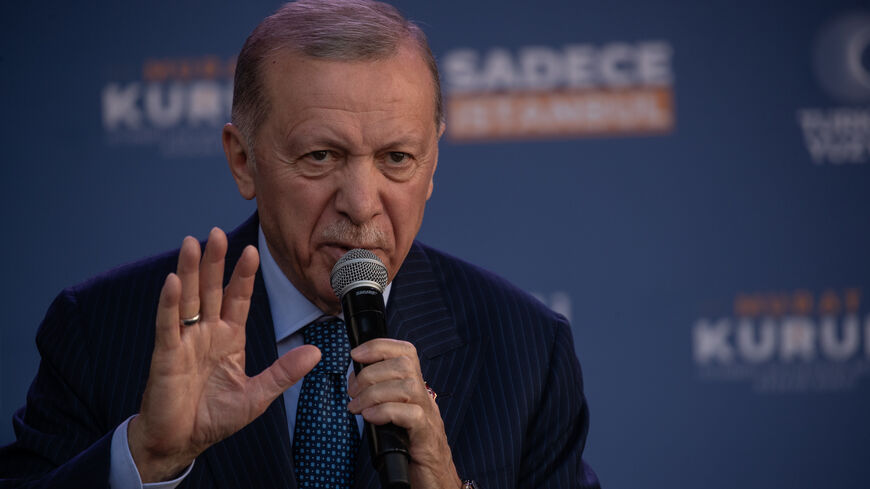 ISTANBUL, TURKEY - MARCH 29: Turkey's President Recep Tayyip Erdogan speaks to supporters at his party’s Istanbul mayoral candidate Murat Kurum's campaign rally on March 29, 2024 in Istanbul, Turkey. Turkey will hold municipal elections on Sunday March 31, with President Recep Tayyip Erdogan's AK Party aiming to reclaim cities lost in 2019, including the country's largest city of Istanbul and the capital Ankara. (Photo by Burak Kara/Getty Images)