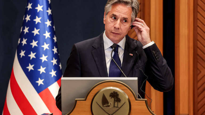 US Secretary of State Antony Blinken listens on his earpiece during a joint press conference with his Qatari counterpart in Doha on June 12, 2024. (Photo by Karim JAAFAR / AFP) (Photo by KARIM JAAFAR/AFP via Getty Images)