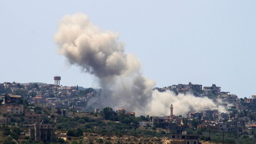 The aftermath of an Israeli air strike on the south Lebanon village of Aita al Shaab near the border