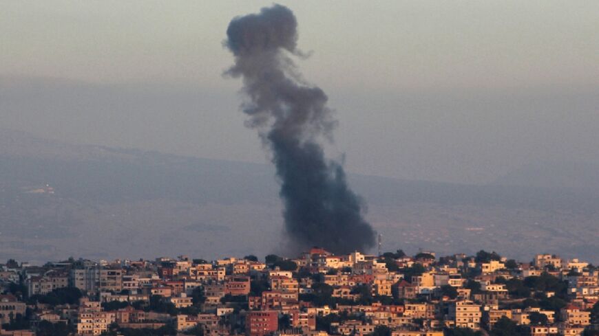 Smoke billows from the site of an Israeli airstrike targeting a southern Lebanese village