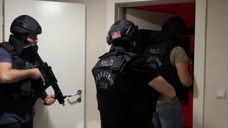 Turkish security forces carry out a raid against ISIS suspects.