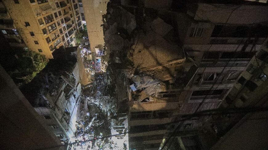 The destroyed top floors of an eight storey building in Beirut hit by an Israeli strike that targeted a top Hezbollah commander