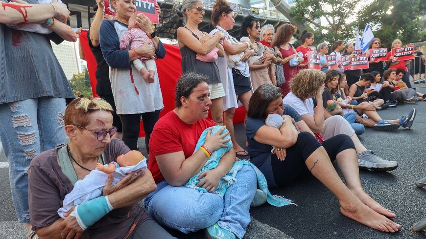 Women in the Israeli city of Tel Aviv take part in a demonstration for the release of hostages still held by Palestinian militants in the Gaza Strip 