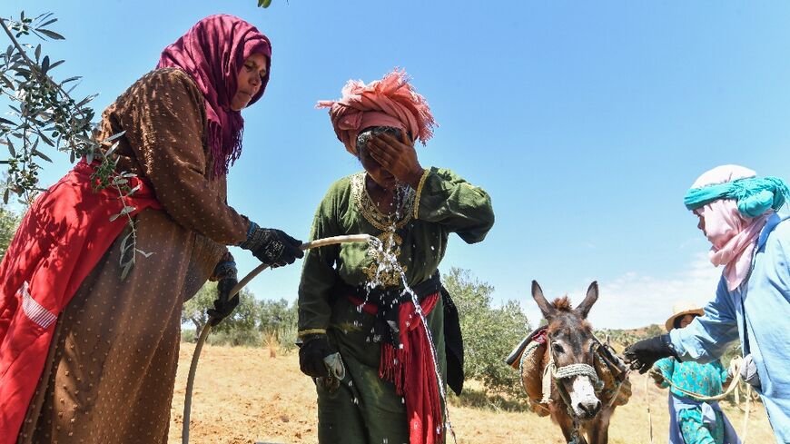 'Most families come to fetch water while we're working, and sometimes we can't do both,' said Djaouher Kammoun, a 26-year-old farmer