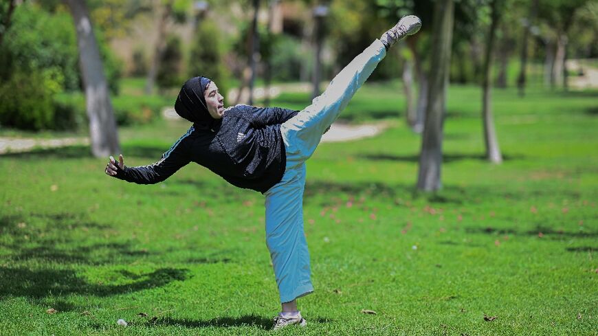 Mais Elbostami trains in a Cairo park