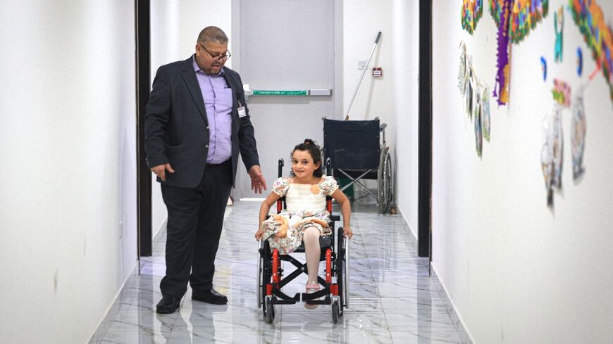 Maryam Ahmed, six, is among some 300 child amputees from Gaza who are receiving therapy at the Thumama complex in Qatar, 2022 World Cup accommodation now being used to house Gaza war evacuees and their carers