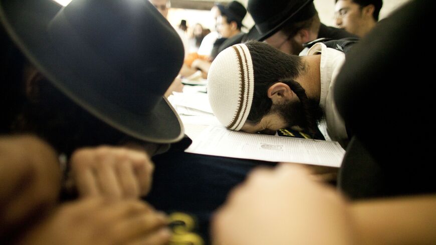 Jewish worshippers pray at Joseph's Tomb as hundreds of faithful mark the anniversary of the biblical Joseph's death, Nablus, West Bank, July 4, 2011.