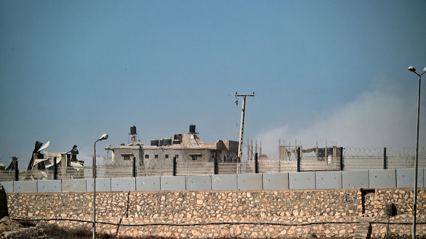 This picture taken from the Egyptian side of the border with the Gaza Strip, shows a damaged building on July 4, 2024, as the conflict between Israel and the Palestinian militant group Hamas continues. (Photo by Giuseppe CACACE / AFP) (Photo by GIUSEPPE CACACE/AFP via Getty Images)