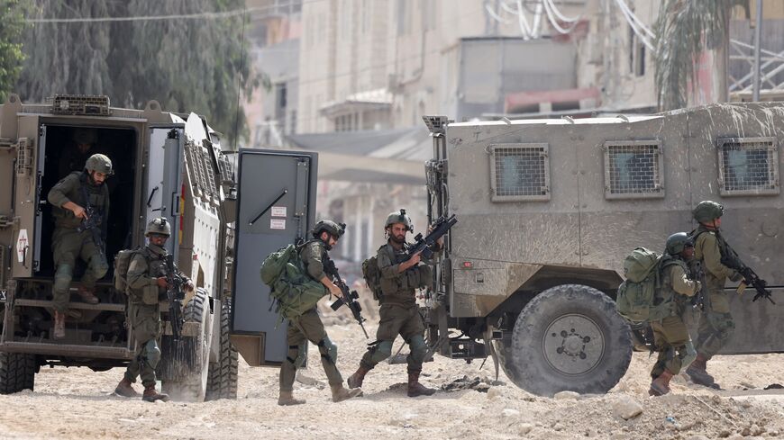 Israeli soldiers operate during a raid in the Nur Shams refugee camp, near Tulkarem, in the Israeli-occupied West Bank, August 28, 2024.