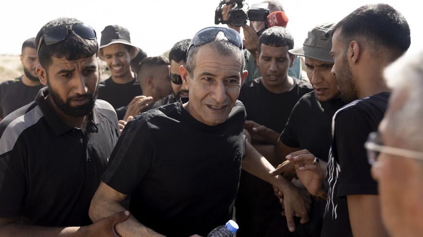 Qaid Farhan Alkaldi (C), who was held hostage by Hamas in Gaza, is greeted as he returns to the unrecognized Bedouin village of Carcur.