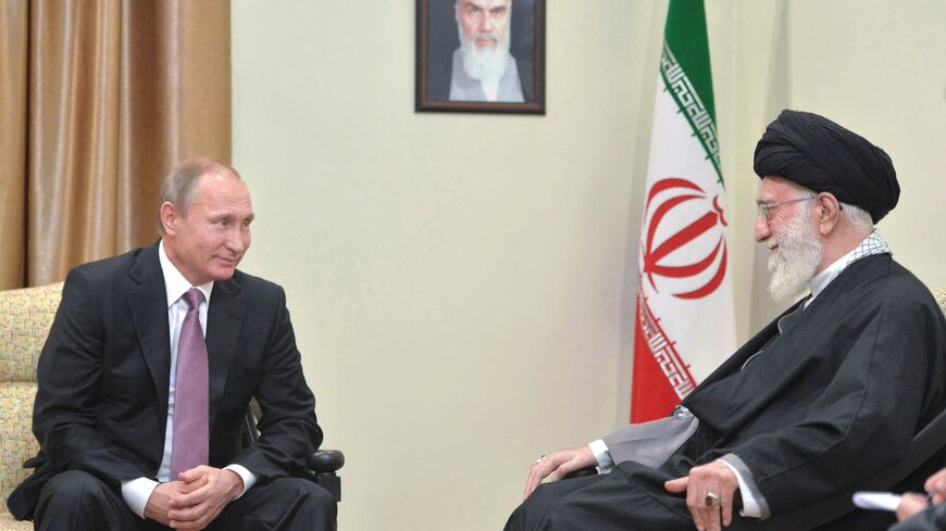 Russian President Vladimir Putin (L) meets with Iran's supreme leader Ayatollah Ali Khamenei in Tehran on November 23, 2015. Putin arrived in Tehran for talks with Khamenei and President Hassan Rouhani, with the Syrian conflict expected to be high on the agenda. The one-day visit will also see Putin take part in a summit of gas exporting countries. AFP PHOTO / SPUTNIK / ALEXEI DRUZHININ (Photo by ALEXEI DRUZHININ / SPUTNIK / AFP) (Photo by ALEXEI DRUZHININ/SPUTNIK/AFP via Getty Images)