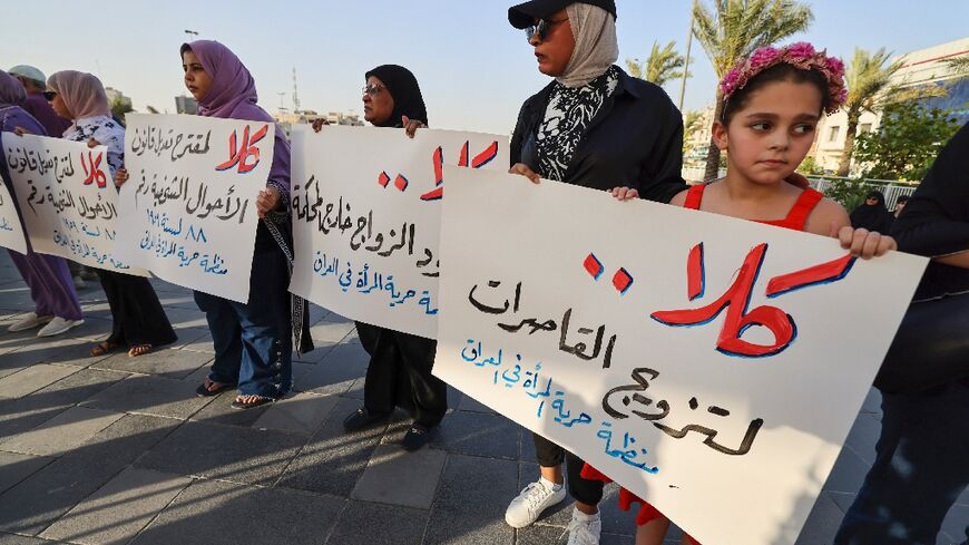 Activists in Baghdad's Tahrir Square demonstrate against female child marriage on July 28, 2024