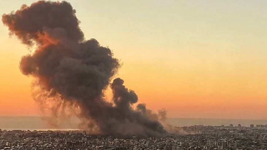 Smoke rises over Beirut's southern suburbs after an Israeli strike targeted Hezbollah's headquarters on Friday afternoon