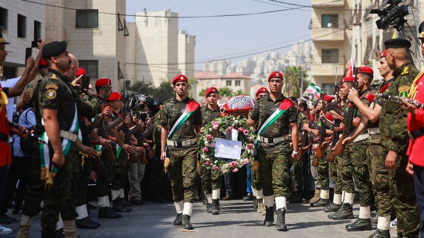 Palestinian security forces carry the body of slain Turkish-American activist Aysenur Ezgi Eygi during a funeral procession in Nablus, in the Israeli-occupied West Bank